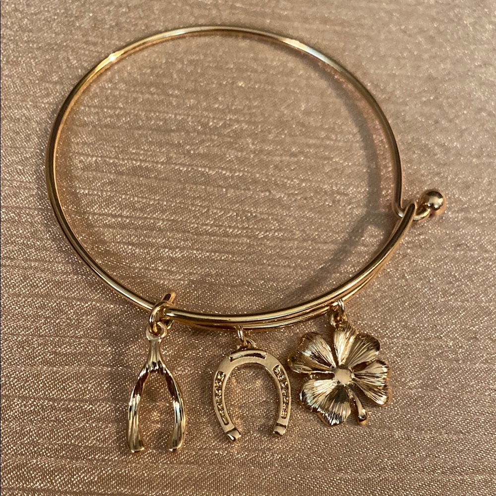 Avon Gold Tone Charm Bracelet with Wishbone, Horseshoe, and Clover